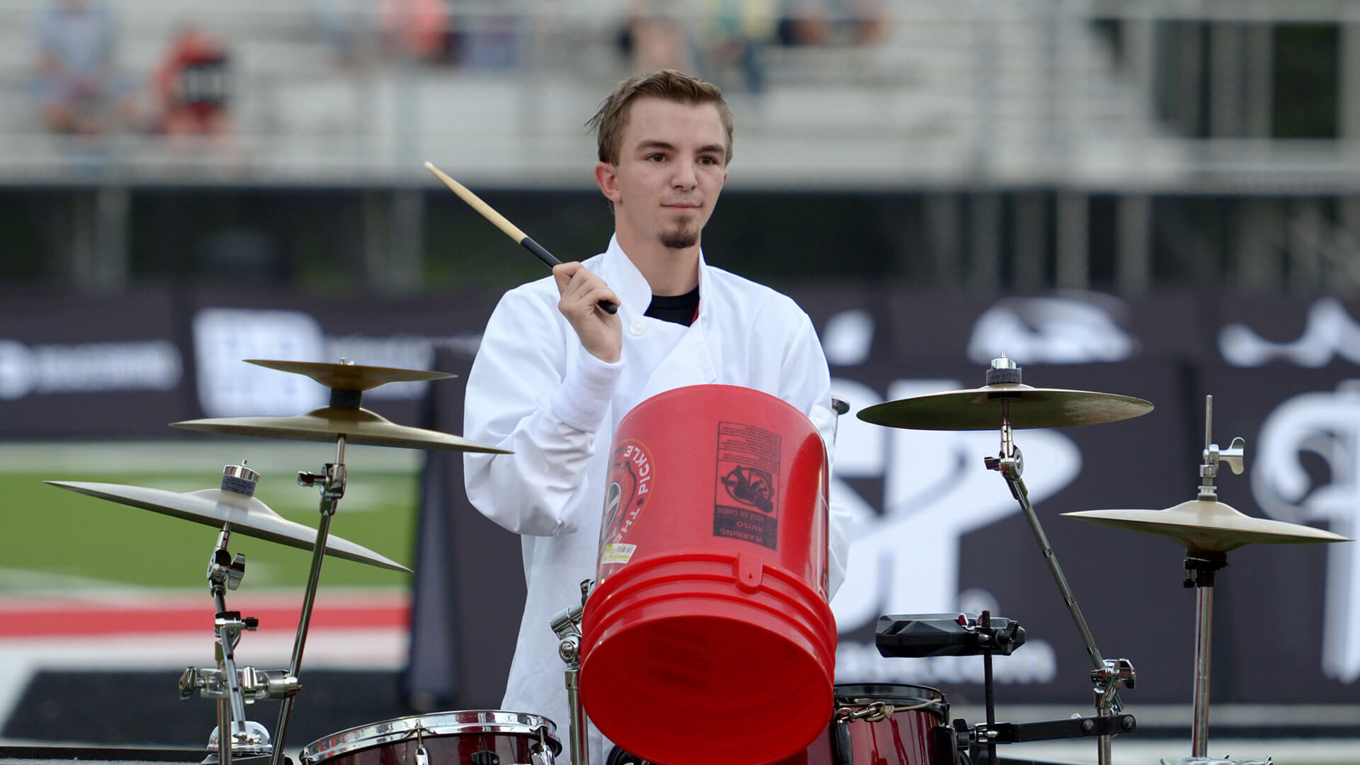 A Florida Xpress percussionist lays down a bucket drum beat.